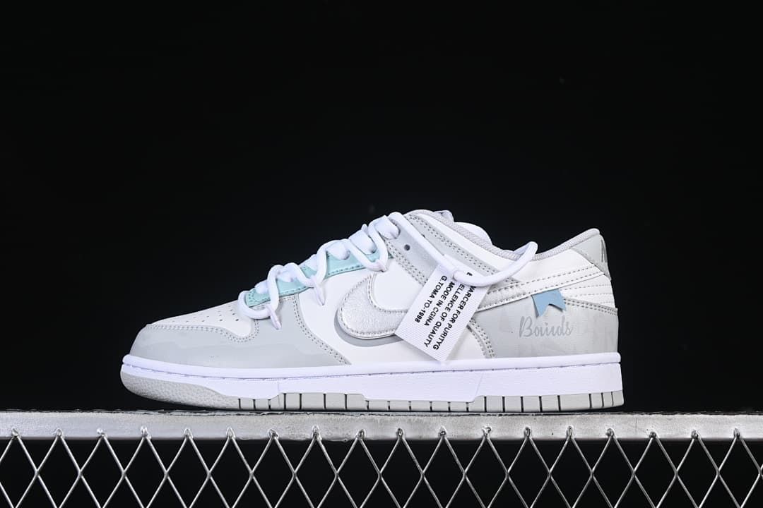 Opposite side profile showing the Swoosh and pale aqua accents