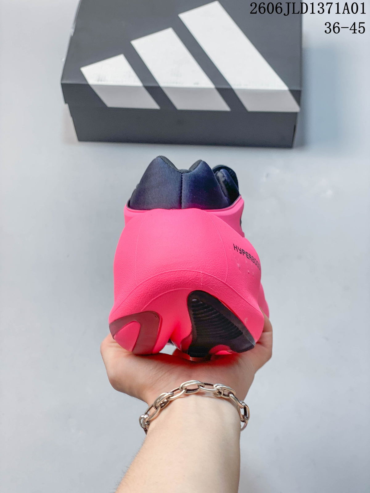 Rear view of an Adidas Hyperboost sneaker with a bright pink heel and navy collar.