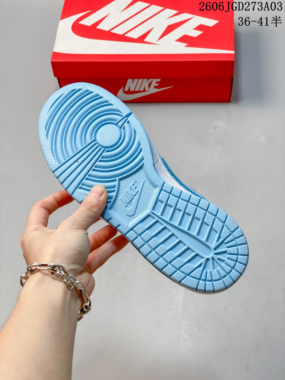 Close-up of the blue outsole with circular tread pattern