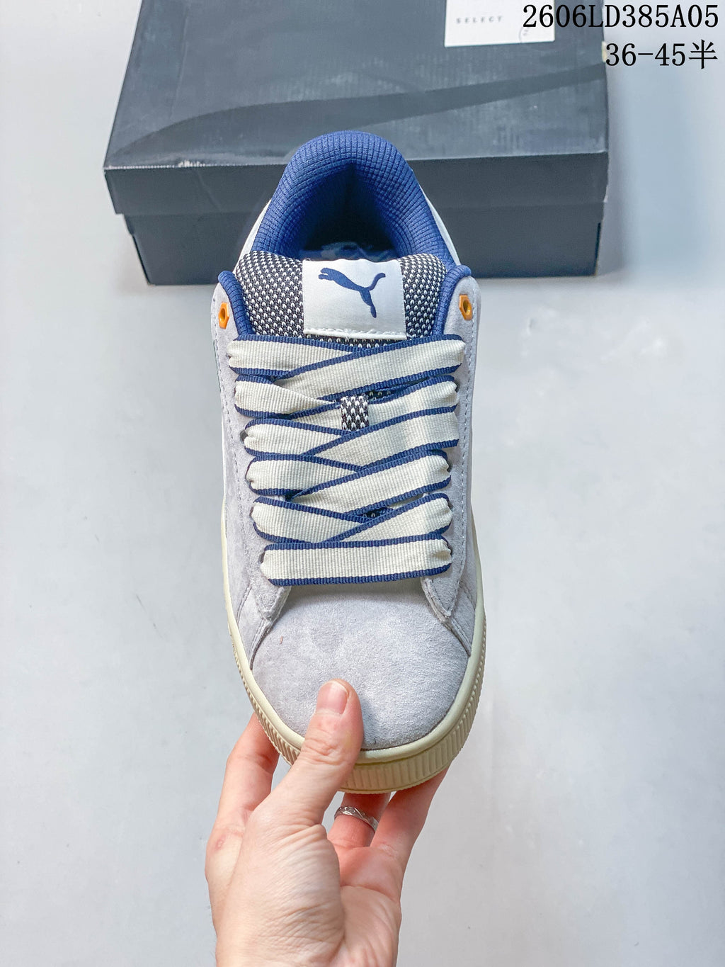 Top view of the sneaker showing its rounded toe, wide laces, and blue accents