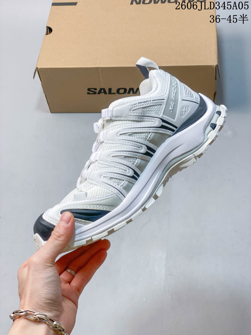 Side view of the white Salomon XT-3D trail running shoe