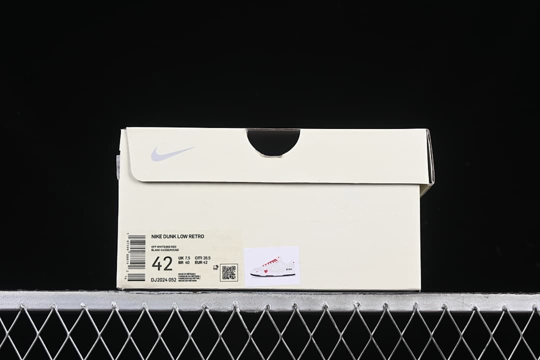 Sneaker box label showing Nike Dunk Low Retro, color text, and size 42