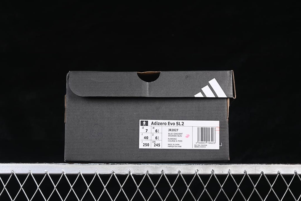 adidas shoebox with a label identifying the Adizero Evo SL2 and sample size details.