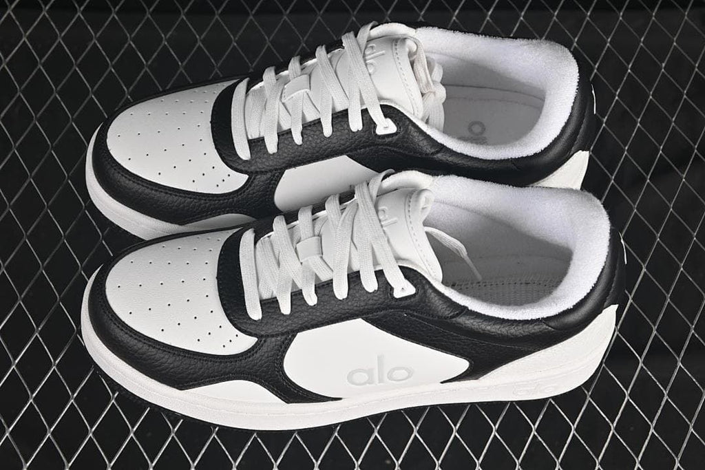 Pair of black-and-white Alo Recovery Mode sneakers viewed from above