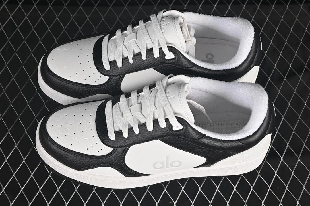 Pair of black-and-white Alo Recovery Mode sneakers viewed from above
