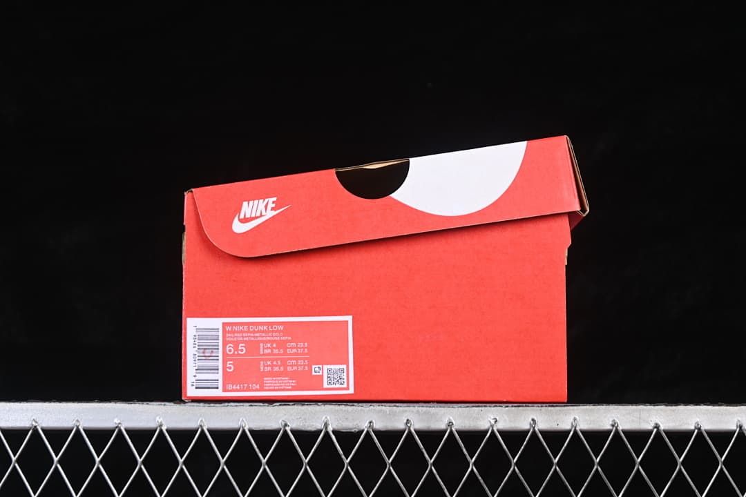 Red shoe box with a visible size label and style code IB4417-104