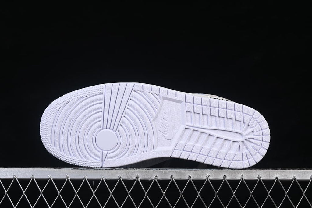 Underside view of the white outsole tread