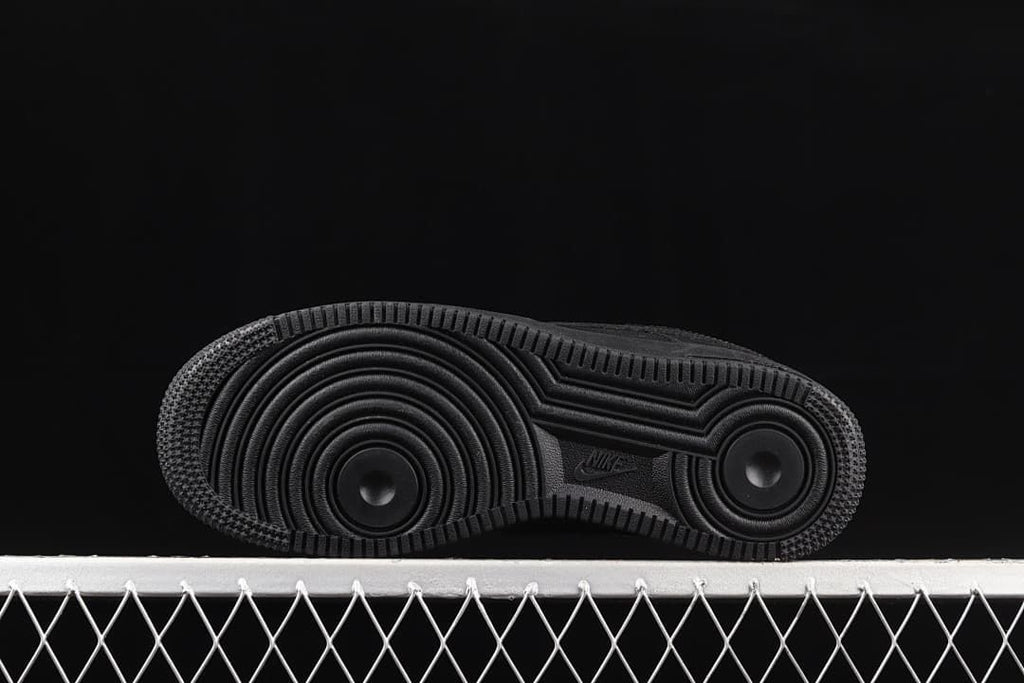 Underside view showing the circular tread pattern on the black outsole.