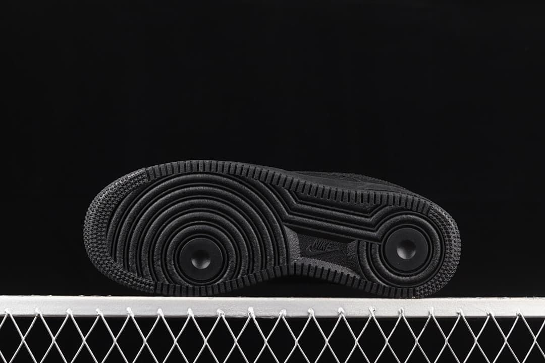 Underside view showing the circular tread pattern on the black outsole.