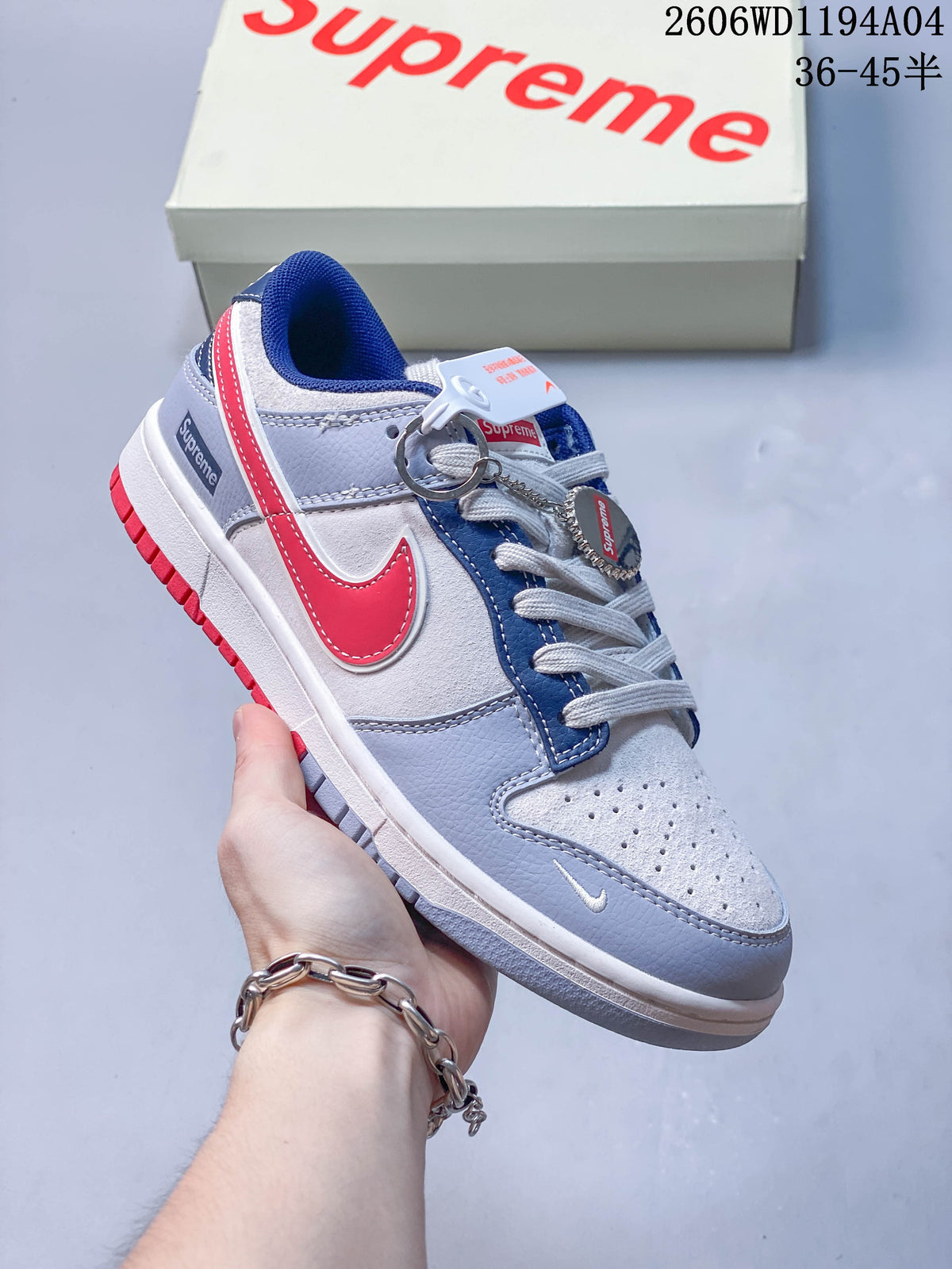 Angled side view of the sneaker with red Swoosh and blue collar lining