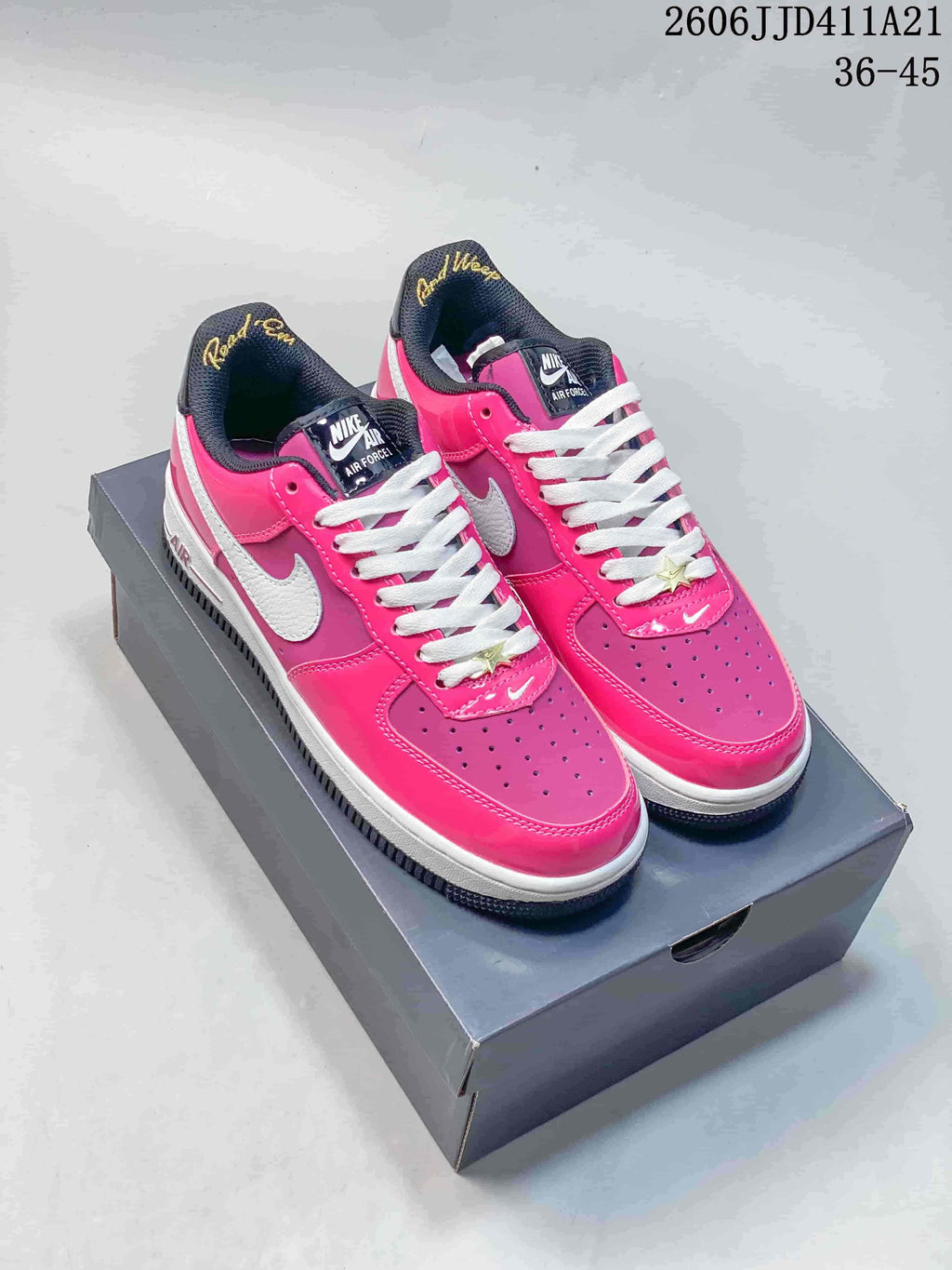 Pair of pink and purple Nike Air Force 1 '07 Low sneakers with white laces and Swoosh details