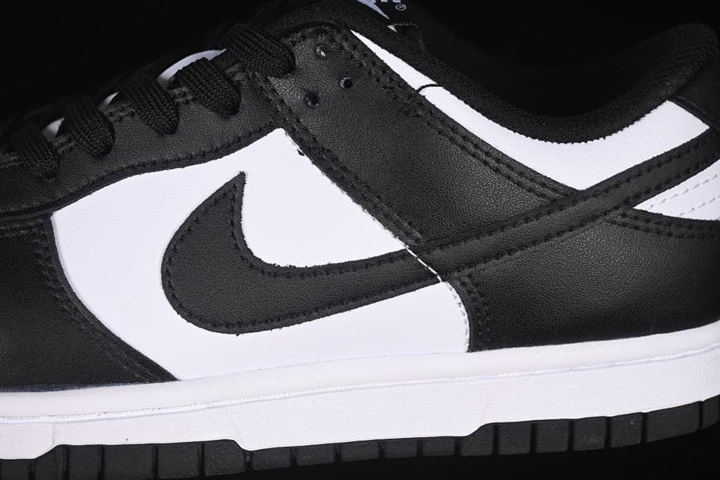 Close-up of the black Swoosh and white side panel