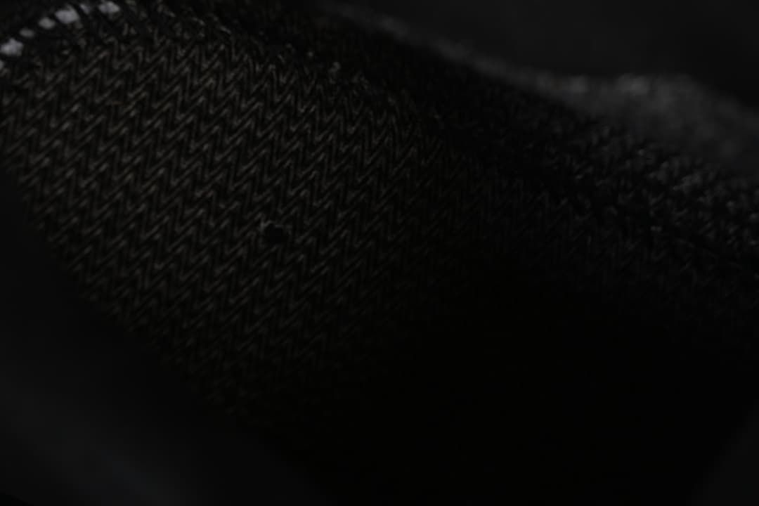 Close-up of the shoe’s dark textured upper.