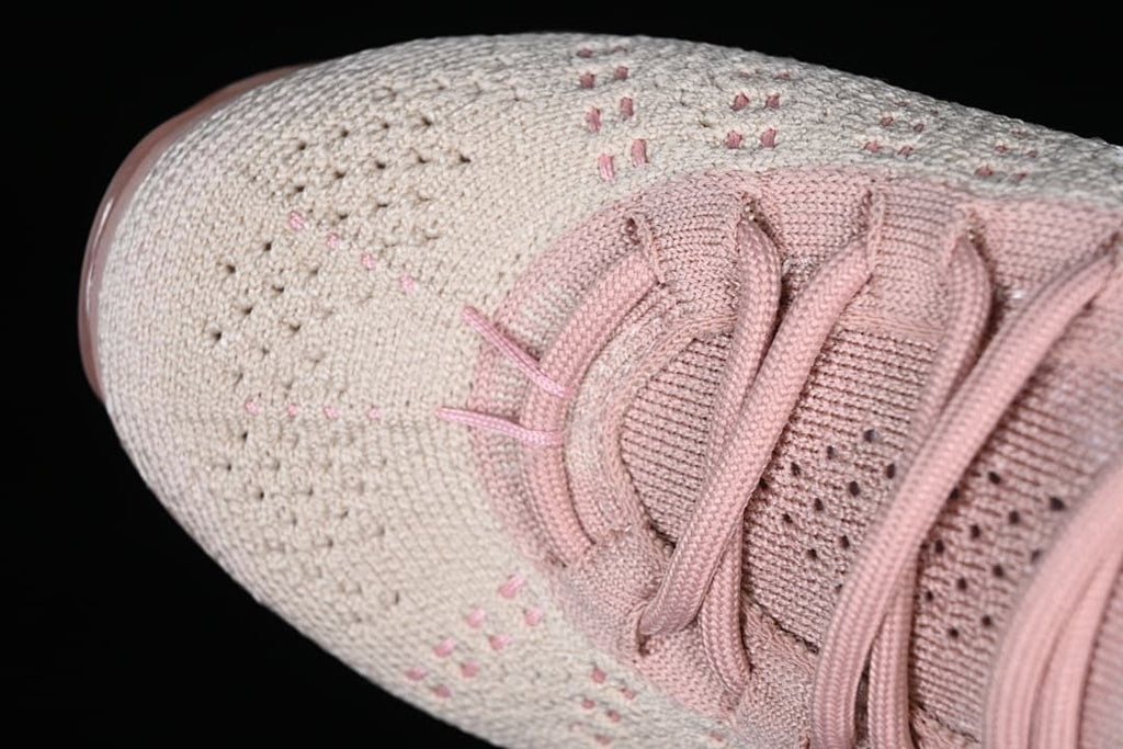 Close-up of the knit-patterned toe and lace area.