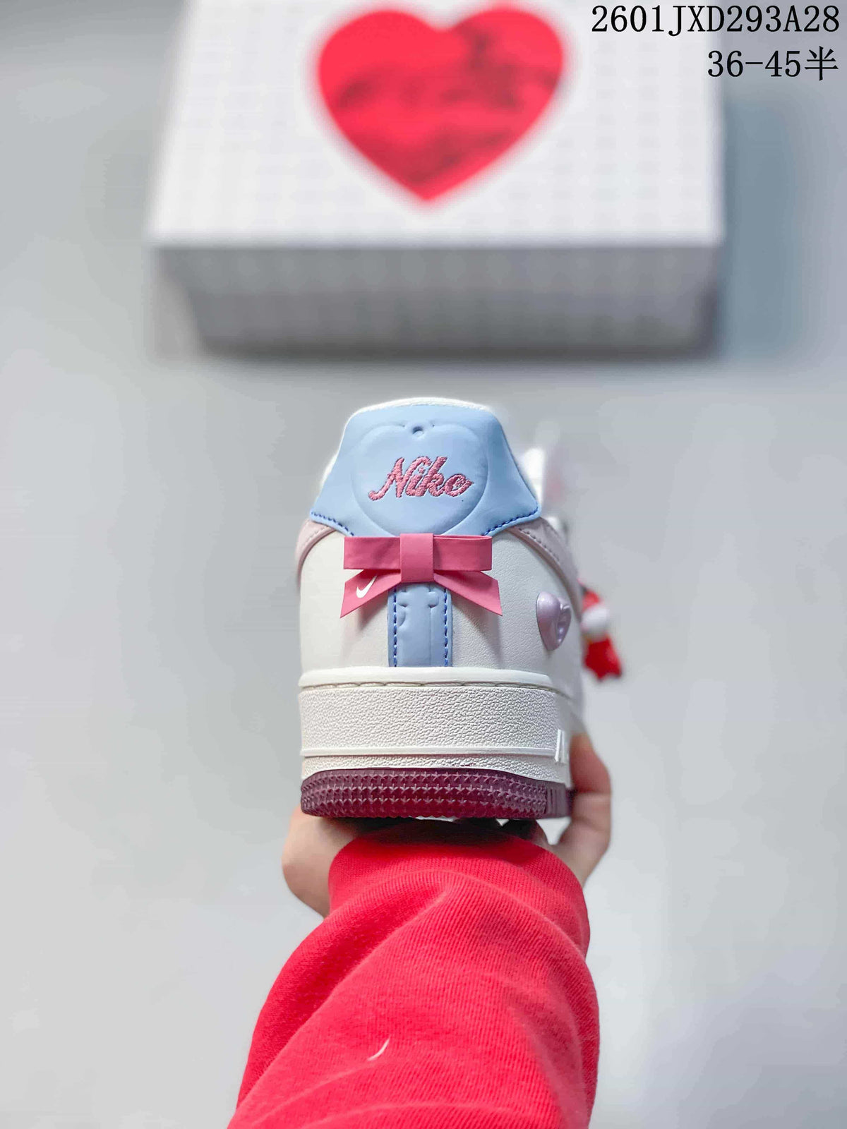 Rear view showing the pink bow and blue heel accent