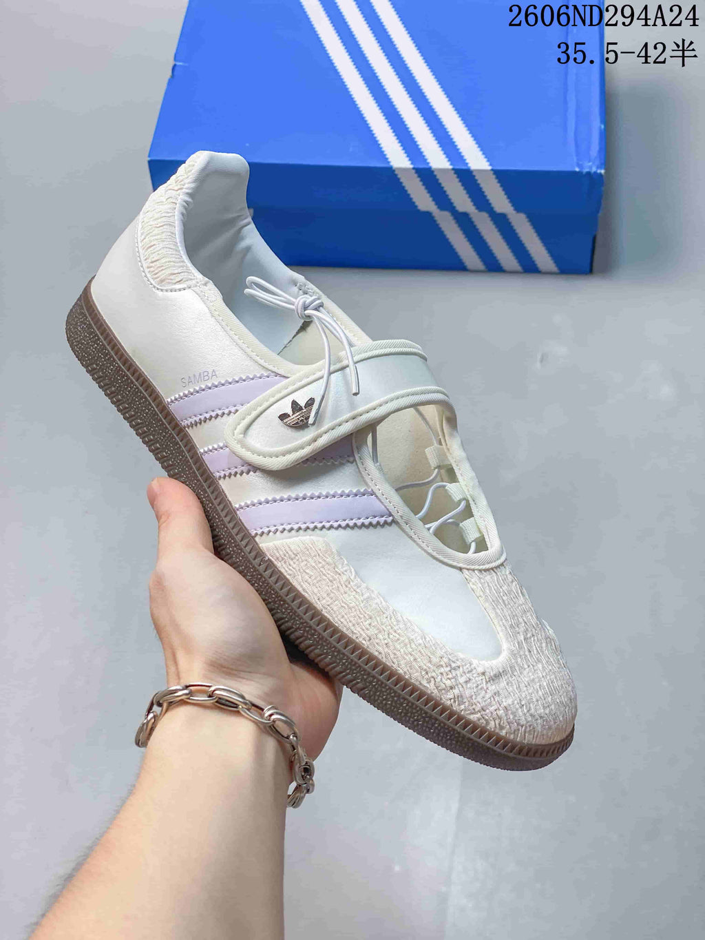 White adidas Samba Jane sneaker with pale lavender stripes, textured toe and strap closure