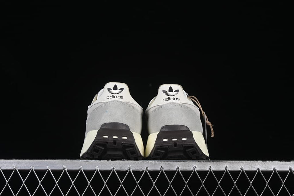 Rear view of the pair showing the heels and dark outsoles