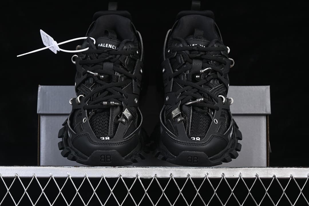 Front view of the pair of black sneakers