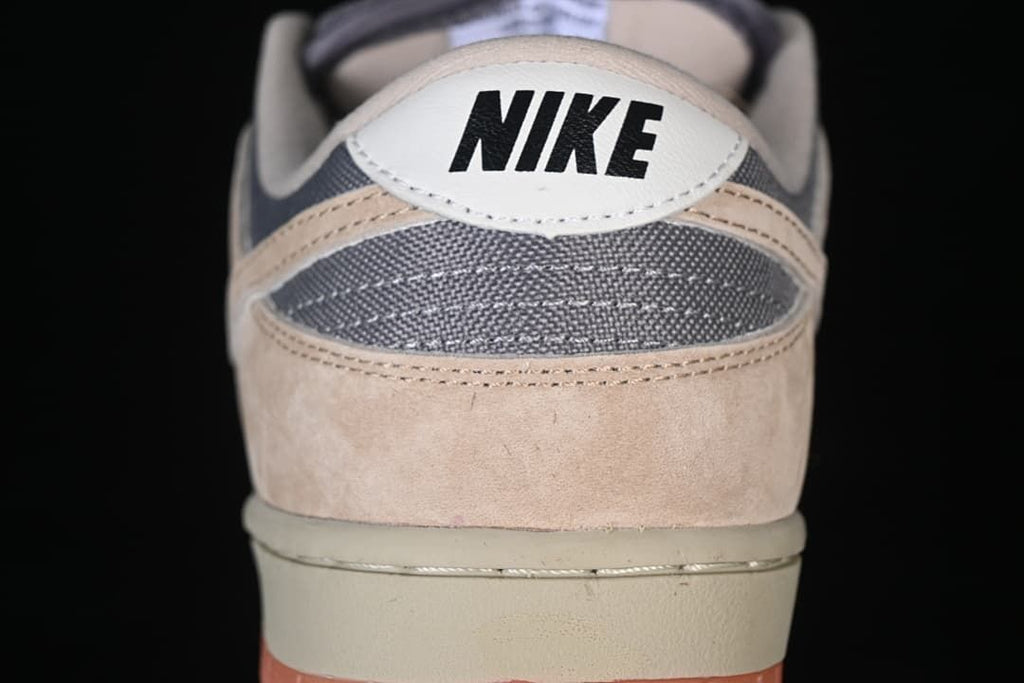 Rear view of the sneaker showing grey heel panels and Nike branding