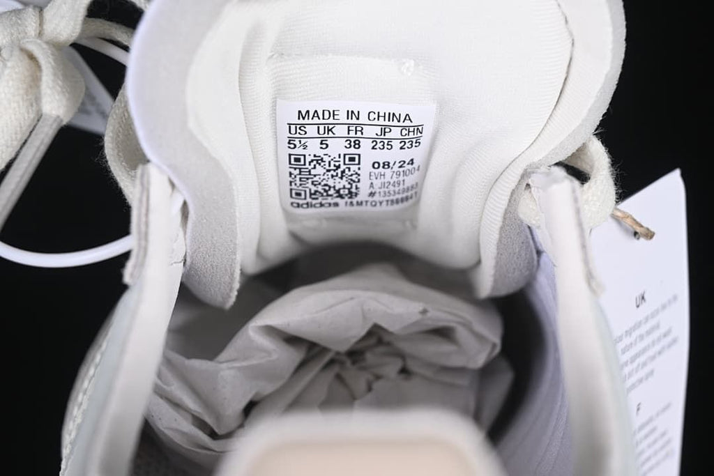 Shoe tongue size label showing EU 38 and model code JI2491