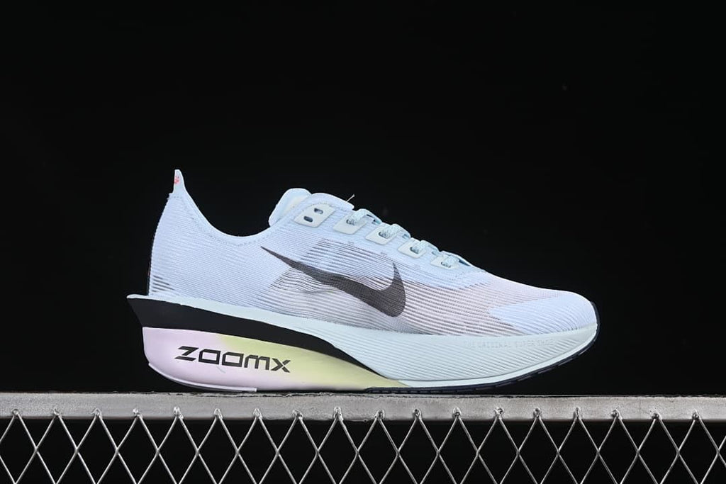 Side profile showing the ZoomX lettering and pale blue upper