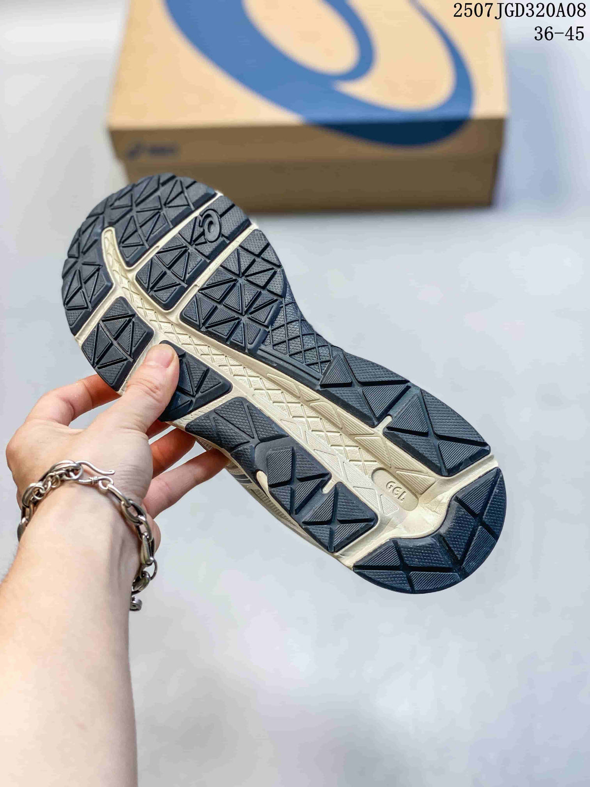 Close-up of the patterned outsole on an ASICS Gel-Contend 4 sneaker.