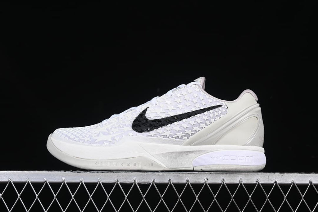 Side view of white Nike Kobe VI Protro basketball shoe with black Swoosh