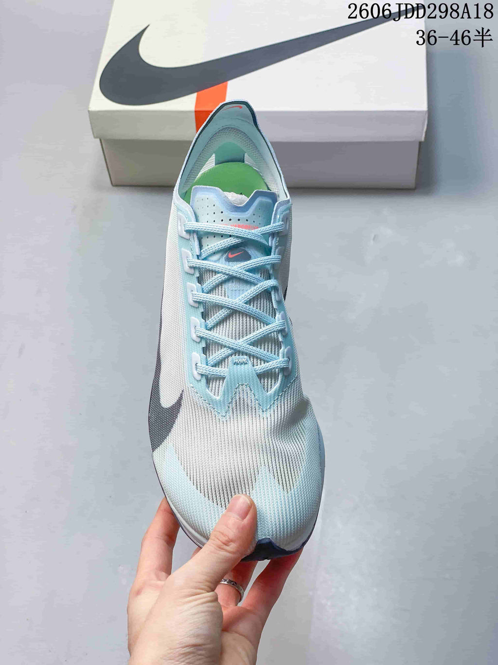Top view of a pale blue and white Nike ZoomX Vaporfly NEXT% 4 shoe