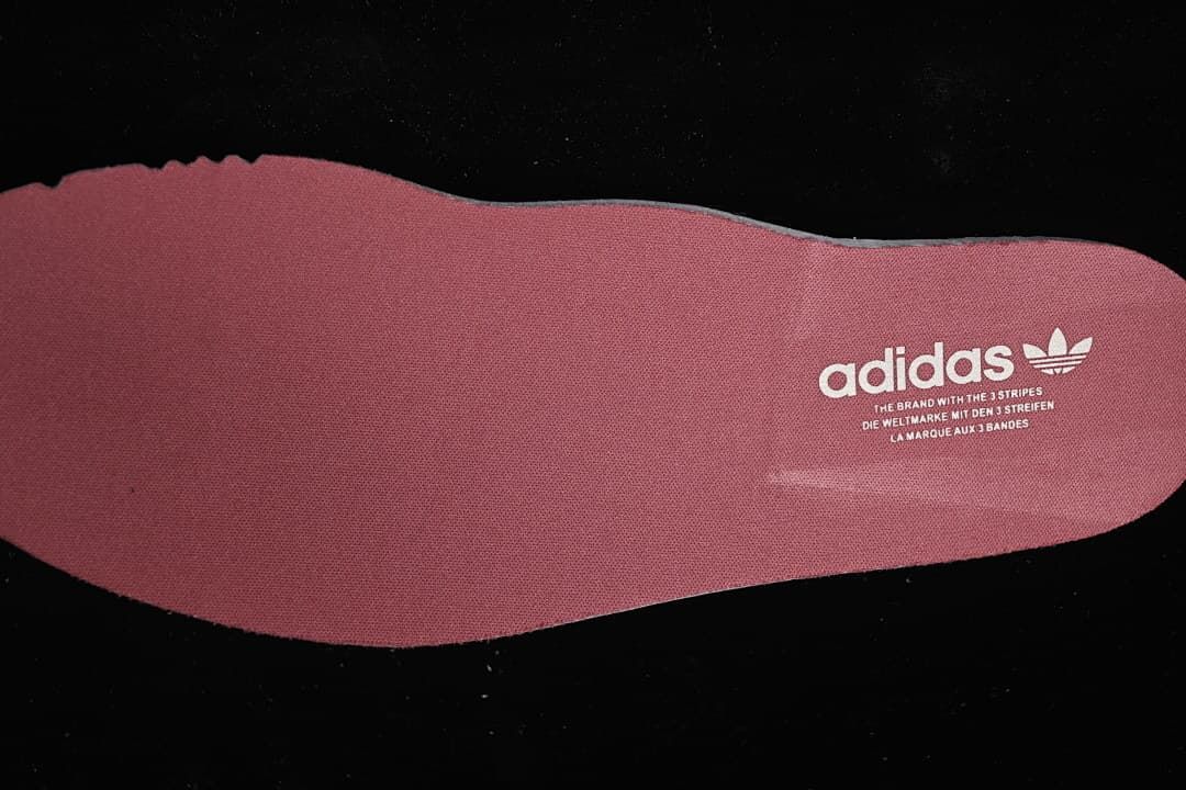 Pink insole with adidas branding