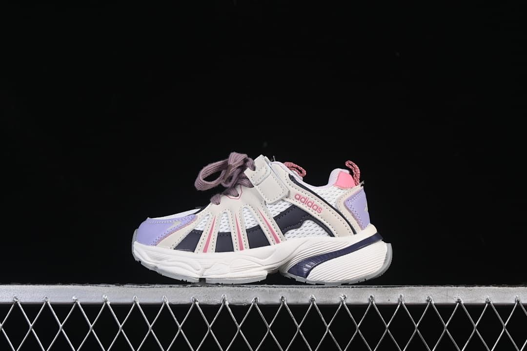 Side view of kids’ adidas Adistar sneakers in cream, white, lavender, navy, and pink