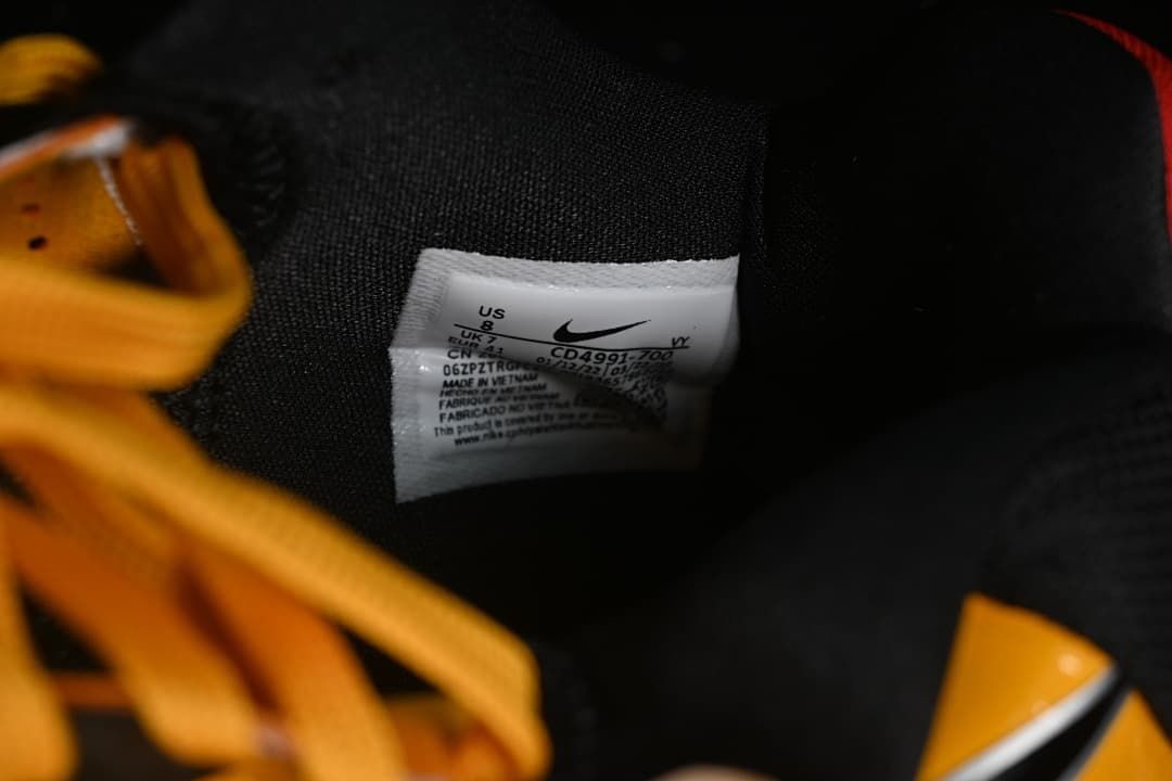 Close-up of the shoe size label and yellow laces
