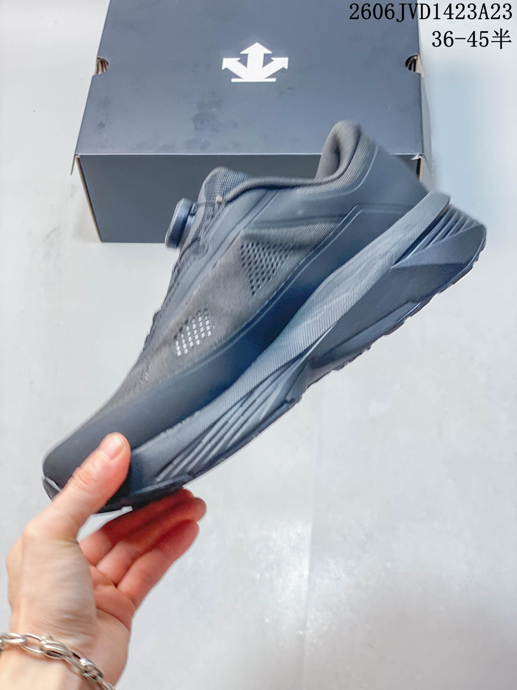Side profile showing the charcoal upper and sole.