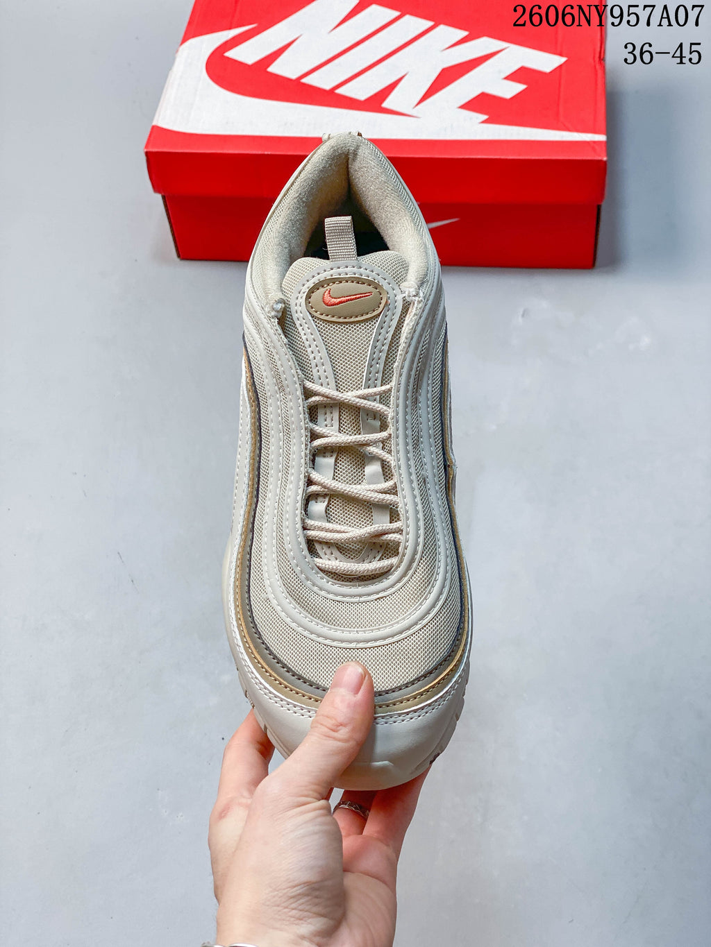 Top view of a beige Nike Air Max 97 sneaker with lace-up fastening