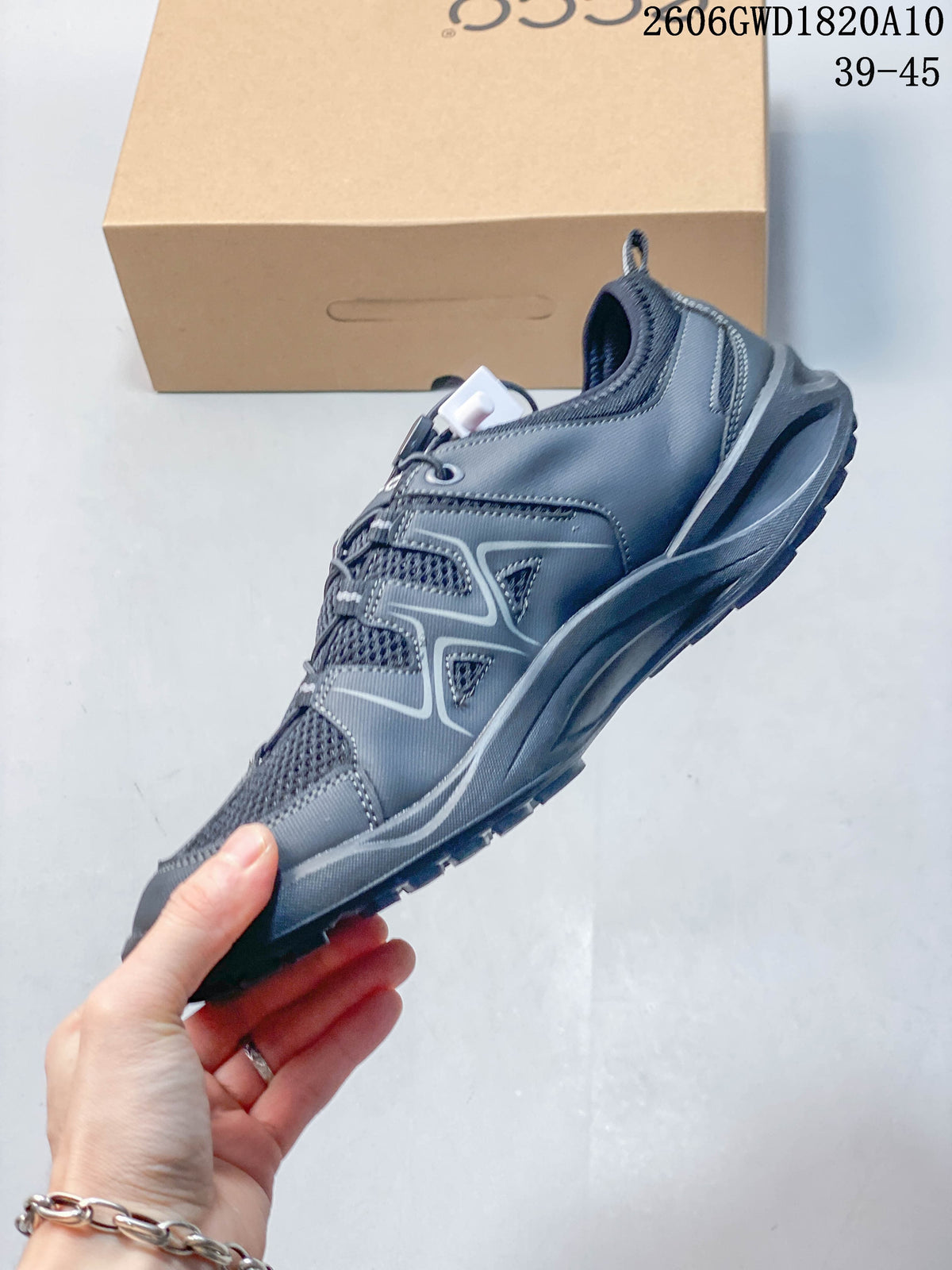 Side view of the grey sneaker showing mesh panels, layered overlays, and quick-lace closure; image shows style code 2606GWD1820A10 and a 39–45 size range.
