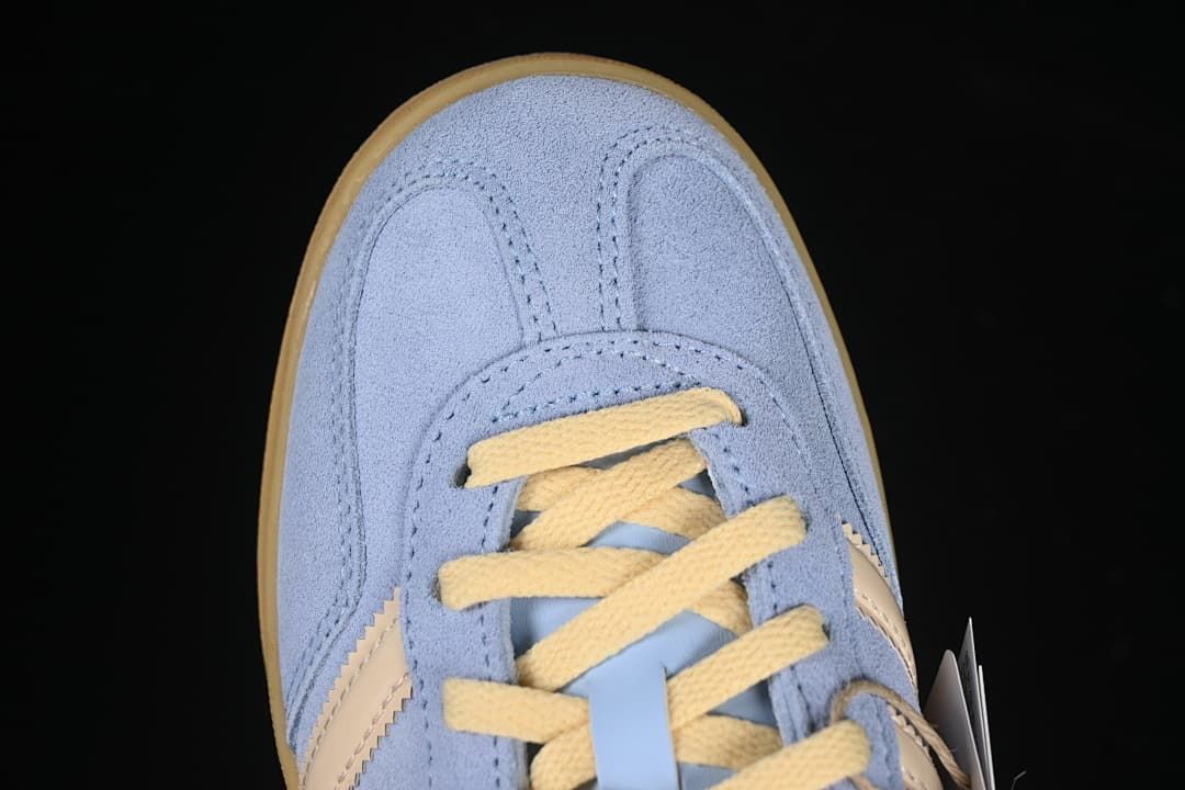 Top-down close-up of the sneaker toe and laces