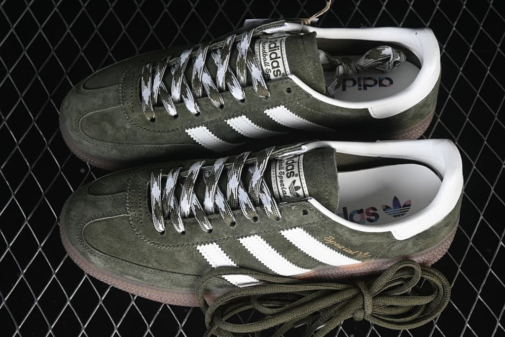 Pair of green Handball Spezial sneakers with an additional set of green laces