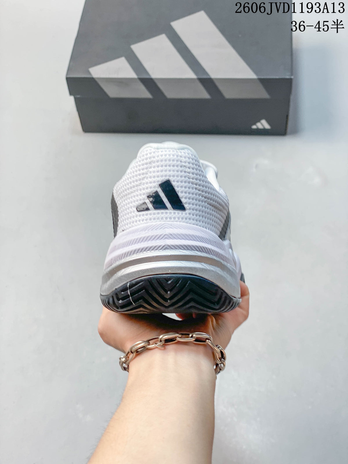 Rear view of an Adidas Barricade 13 shoe showing the heel and outsole
