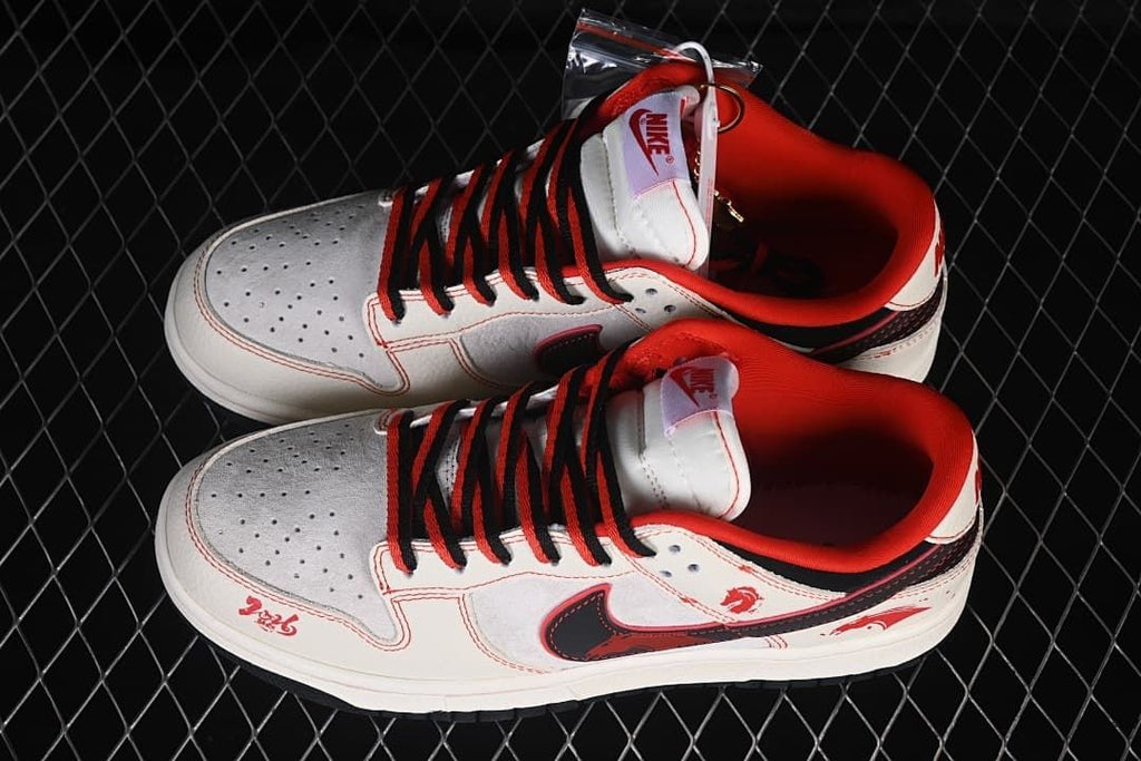 Top view of a pair of off-white Nike SB Dunk Low sneakers with red-and-black laces and horse graphics
