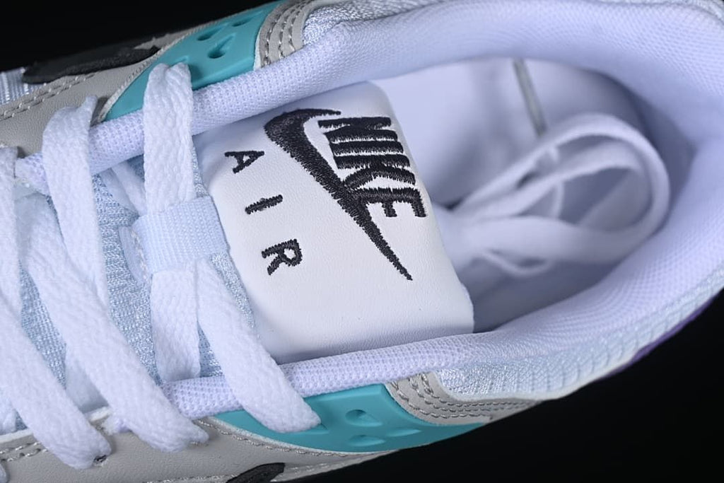 Close-up of the tongue, laces, and turquoise eyelet panel