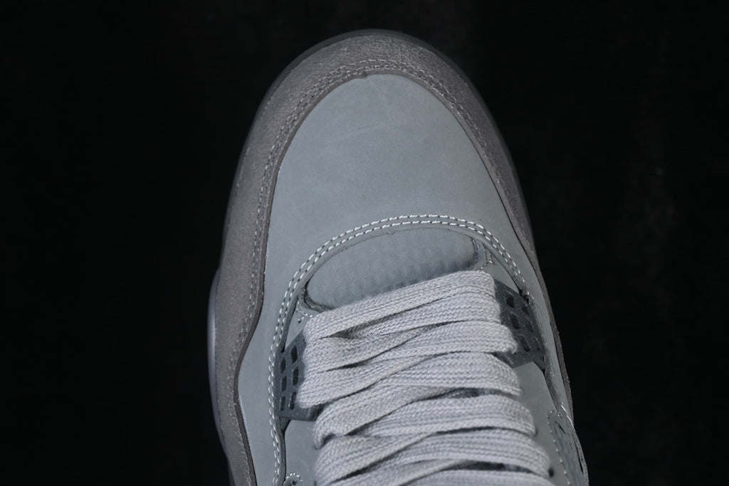 Top-down close-up of the toe and laces on a grey Air Jordan 4 Retro SE.