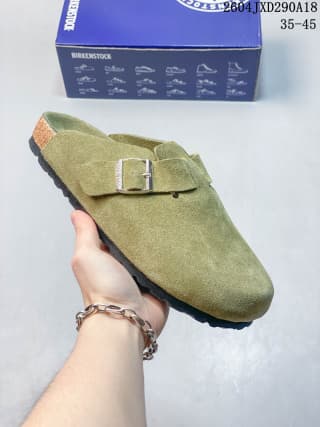 Olive green suede closed-toe clog with a silver buckle, shown with its branded box.