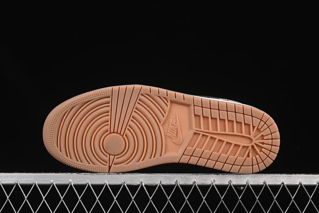 Underside of the sneaker showing a gum-colored tread