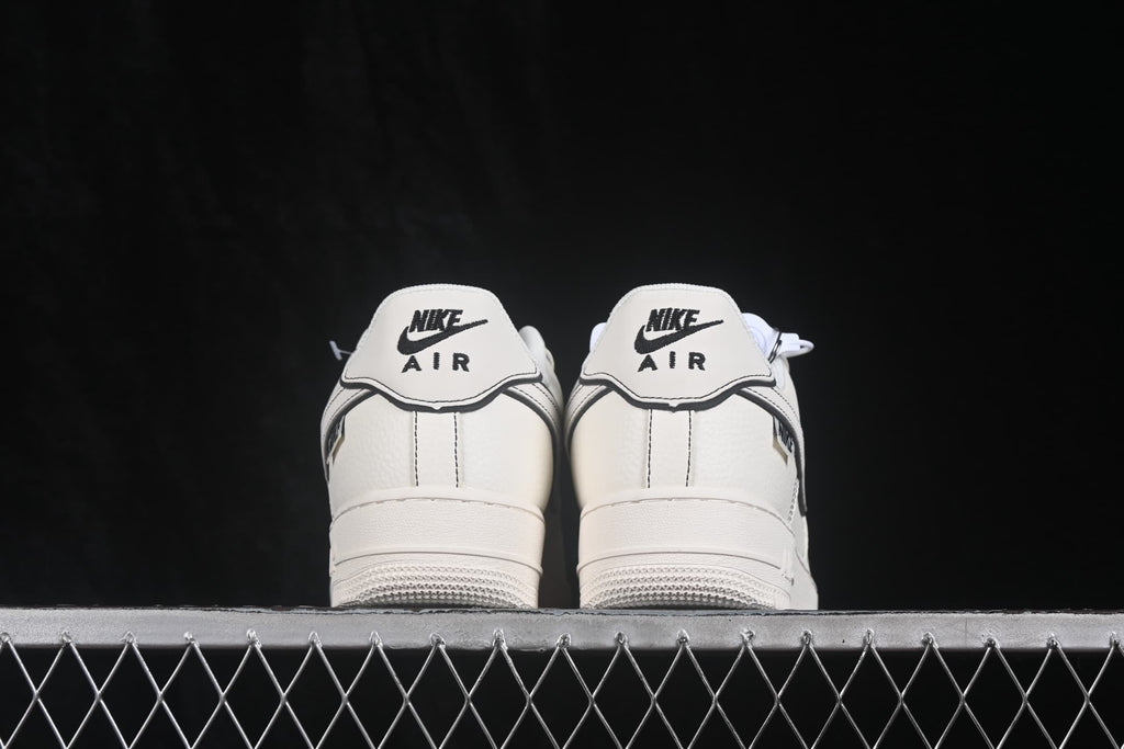 Rear view showing the Nike Air branding on the heel tabs and the white outsole.