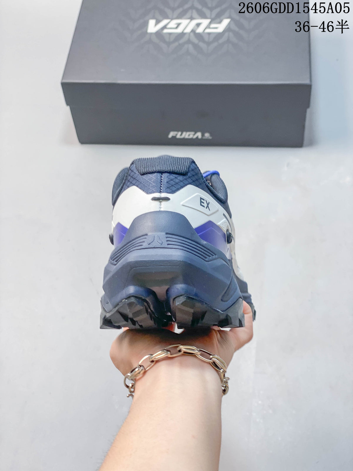 Rear view showing the heel construction and blue-gray color details.