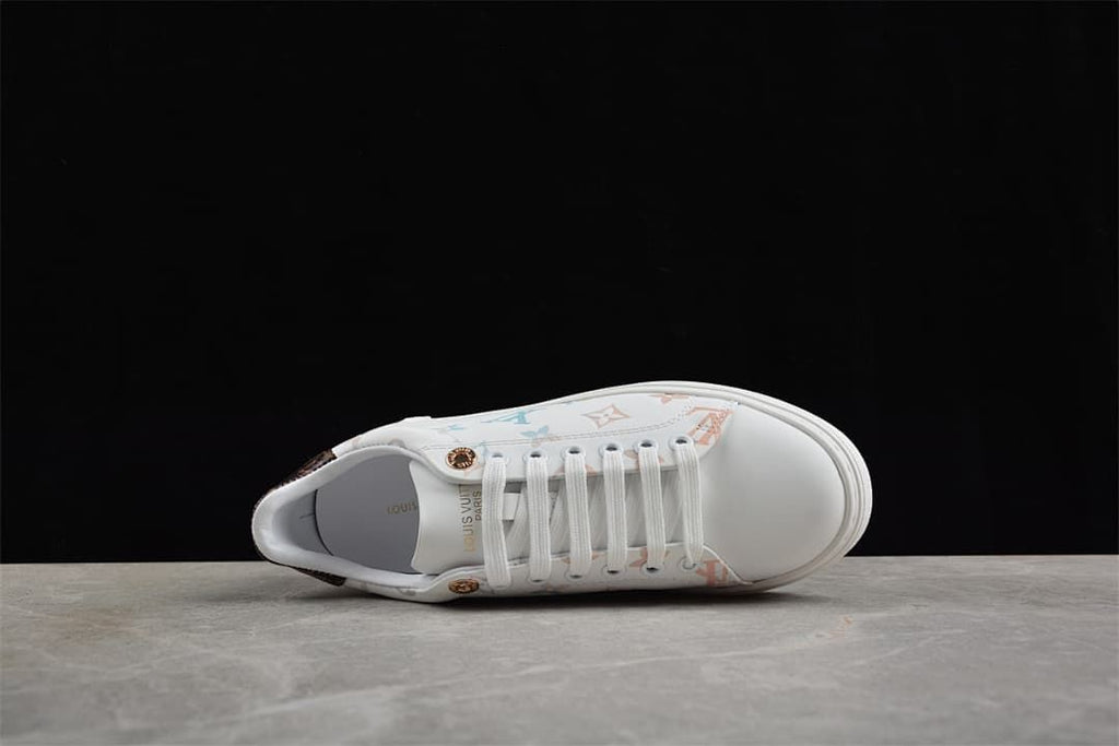 Top view of the white lace-up sneaker with patterned panels
