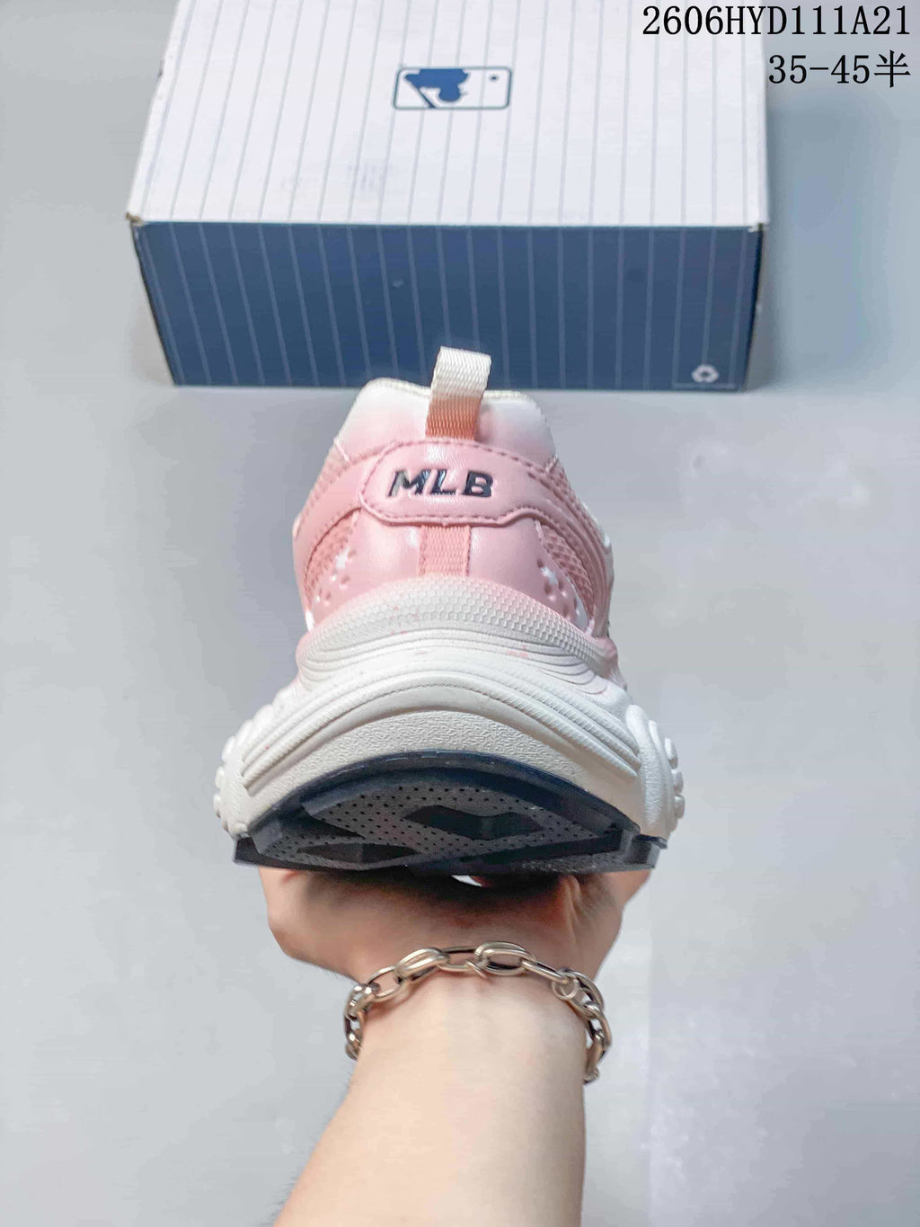 Rear view showing the pink heel panel and MLB branding.