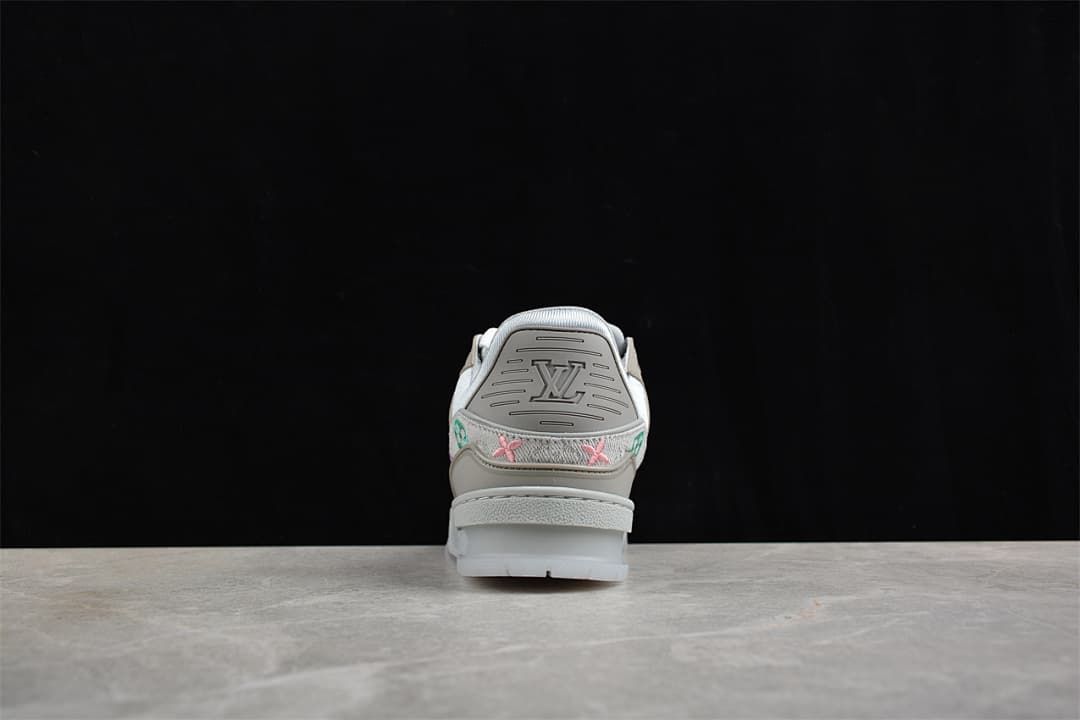 Rear view showing the sneaker heel and embroidered details