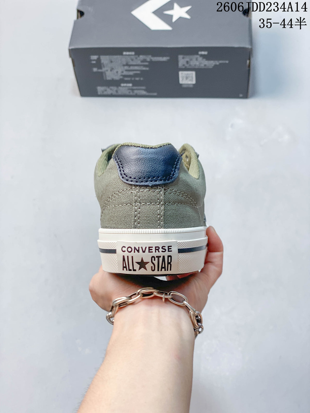 Rear view of the olive Converse sneakers showing the heel branding