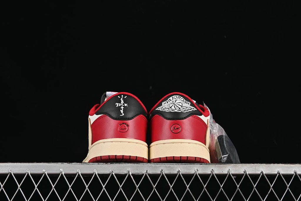 Rear view showing the red heel panels and embroidered heel details