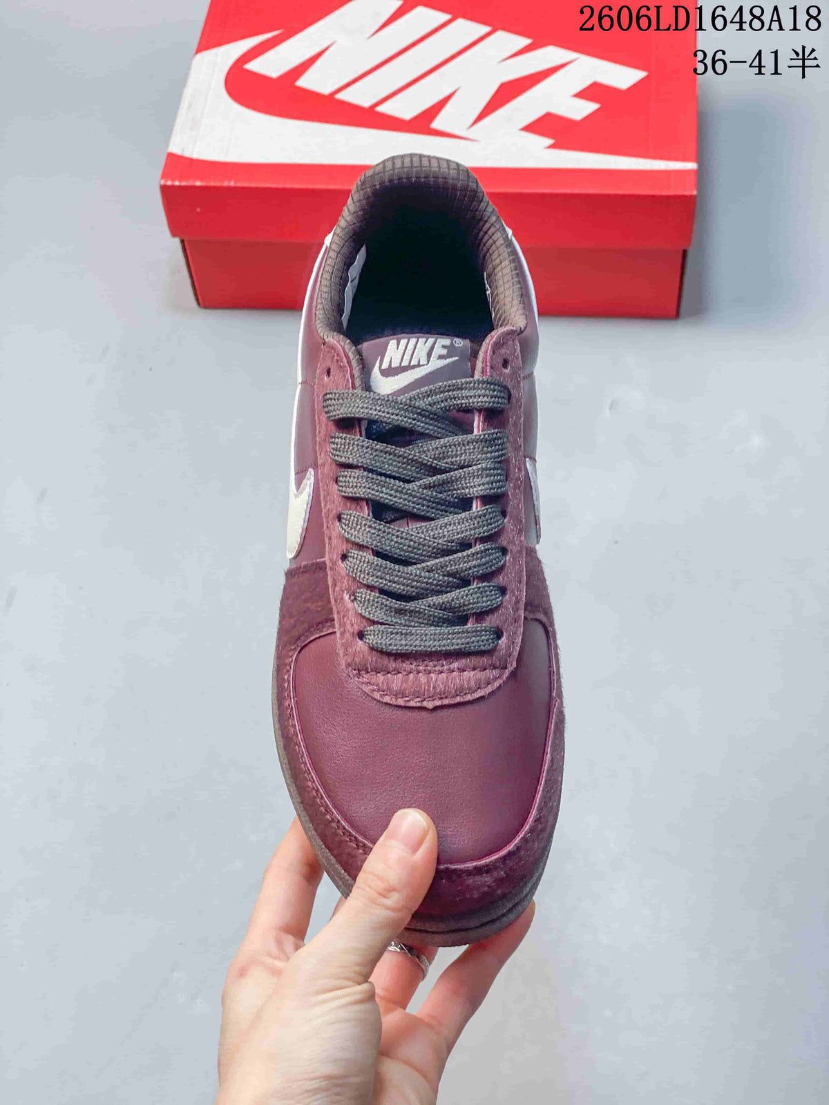 Top view showing the laces, tongue, and burgundy upper